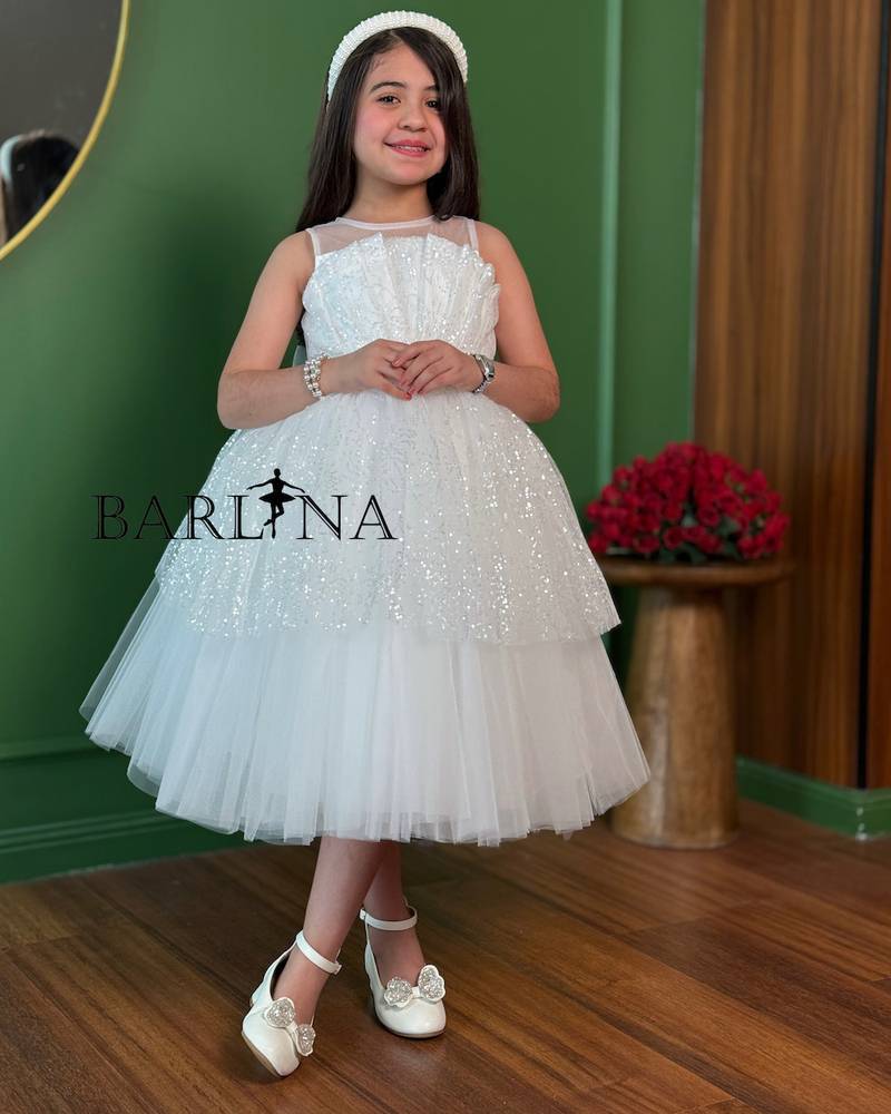 White girls' dress with tulle layers and a touch of sparkle