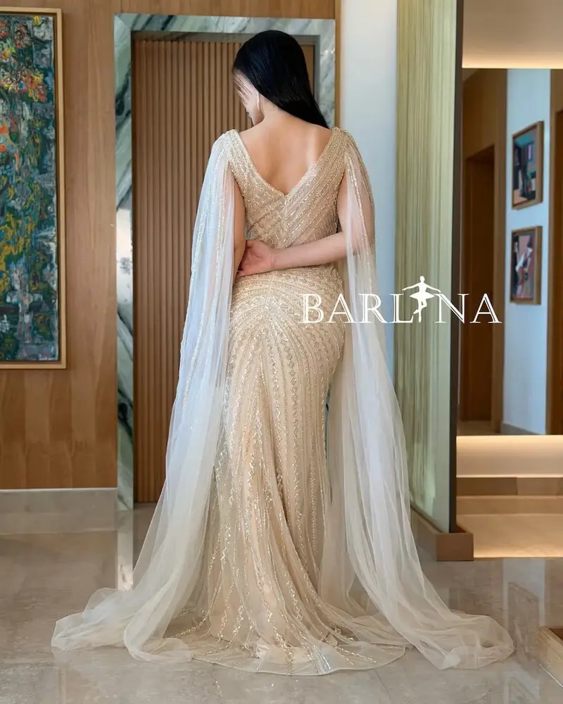 Luxurious off-white evening dress with shimmering embroidery