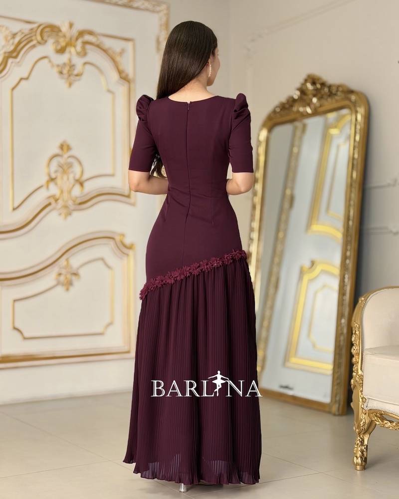 Burgundy pleated dress adorned with roses