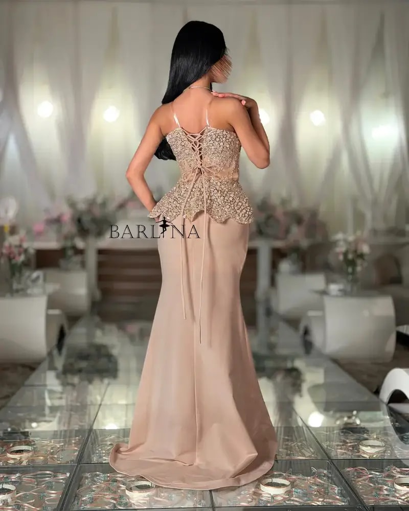 Beige evening dress with an embroidered corset design