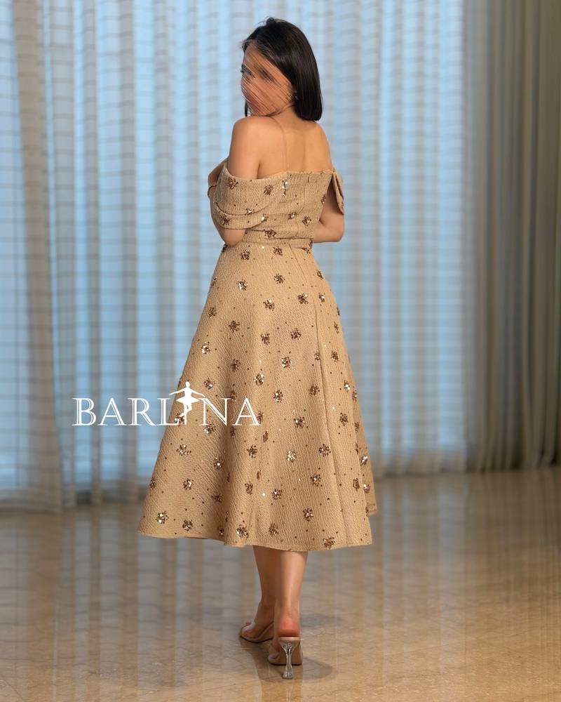 Beige midi dress embellished with gold sequins