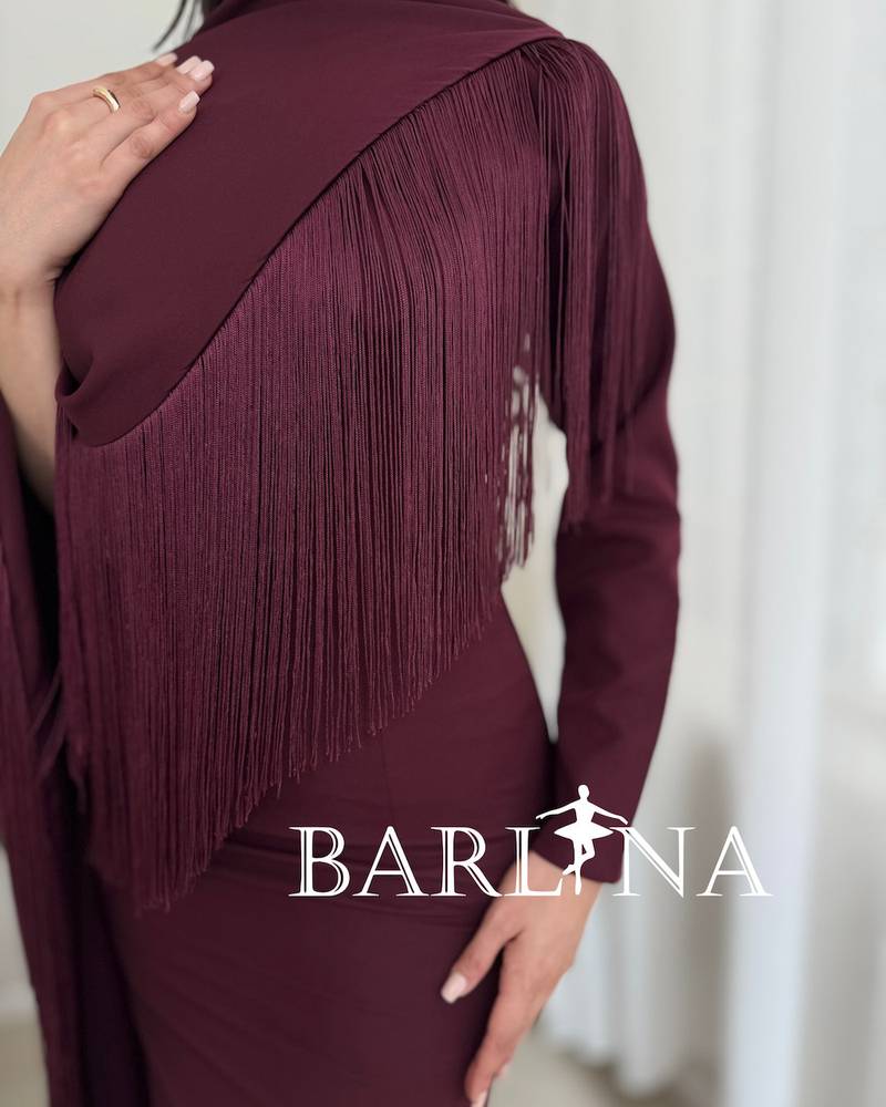 Elegant burgundy dress with a side shawl and tassels