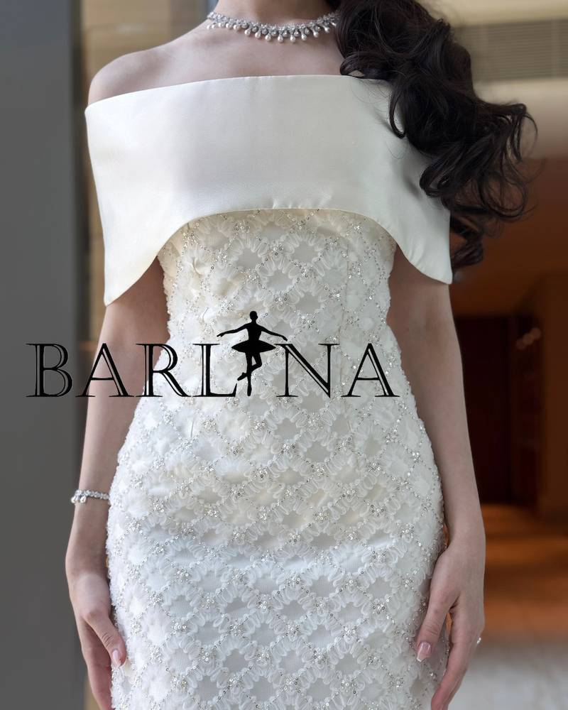 White dress with a slim fit and delicate embroidery