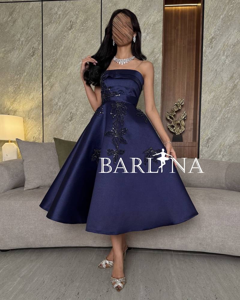 Navy blue off-the-shoulder dress with luxurious embroidery