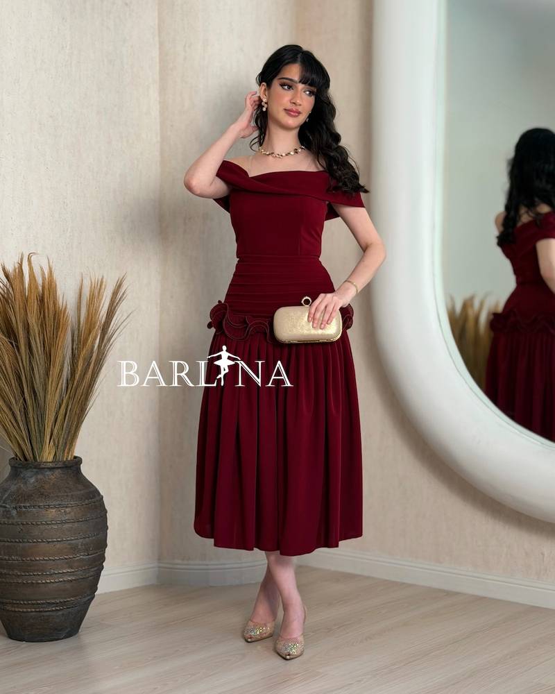 Burgundy dress with ruffles at the waist