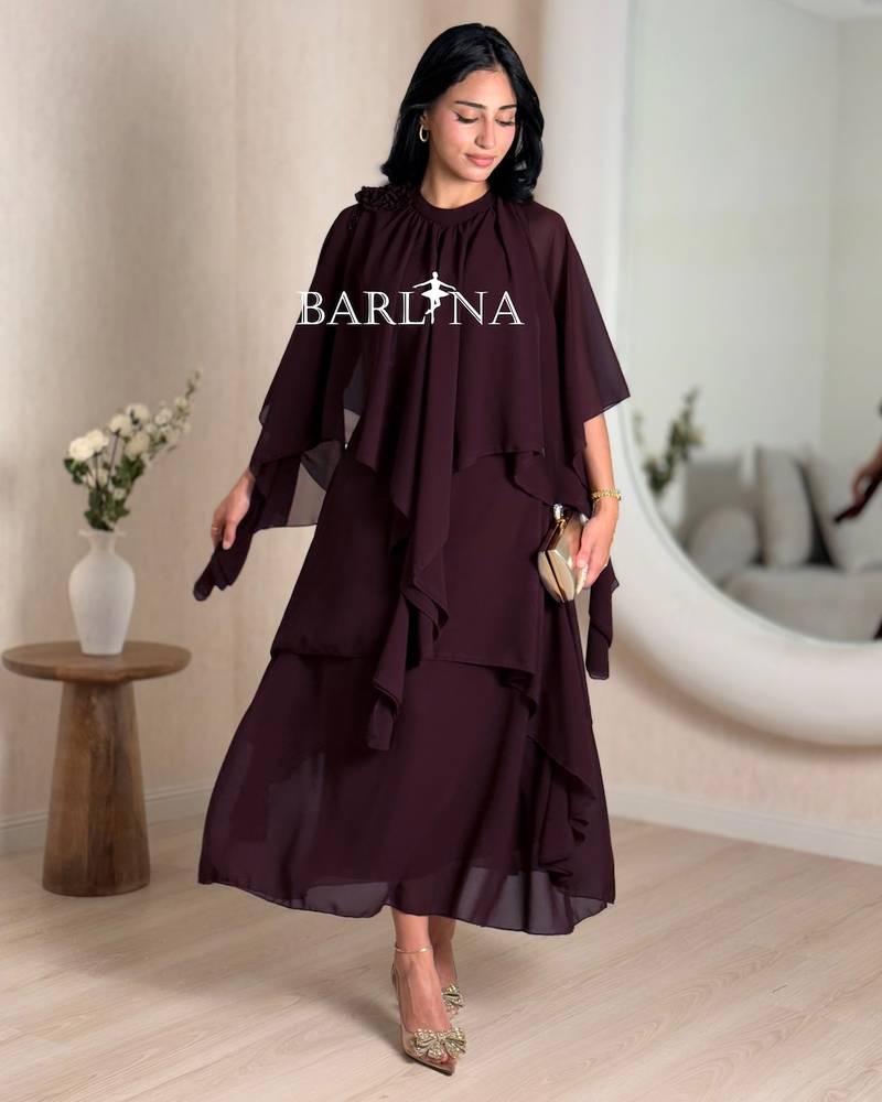 vinous wide dress with layers and cape sleeves