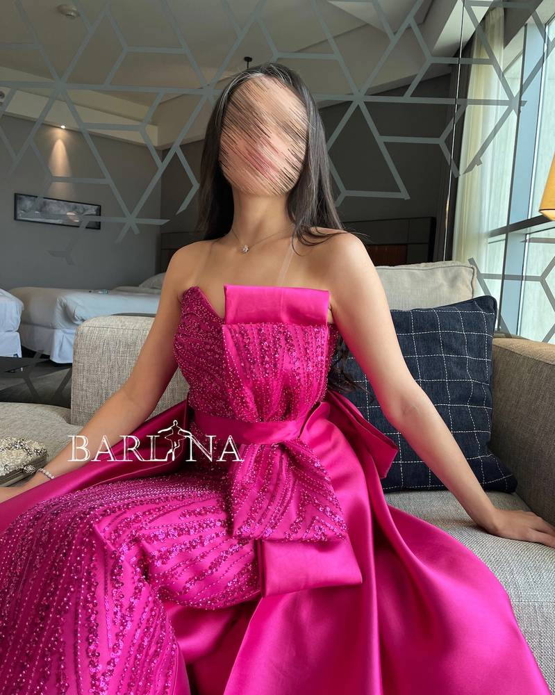 Fuchsia sequin dress with a bow
