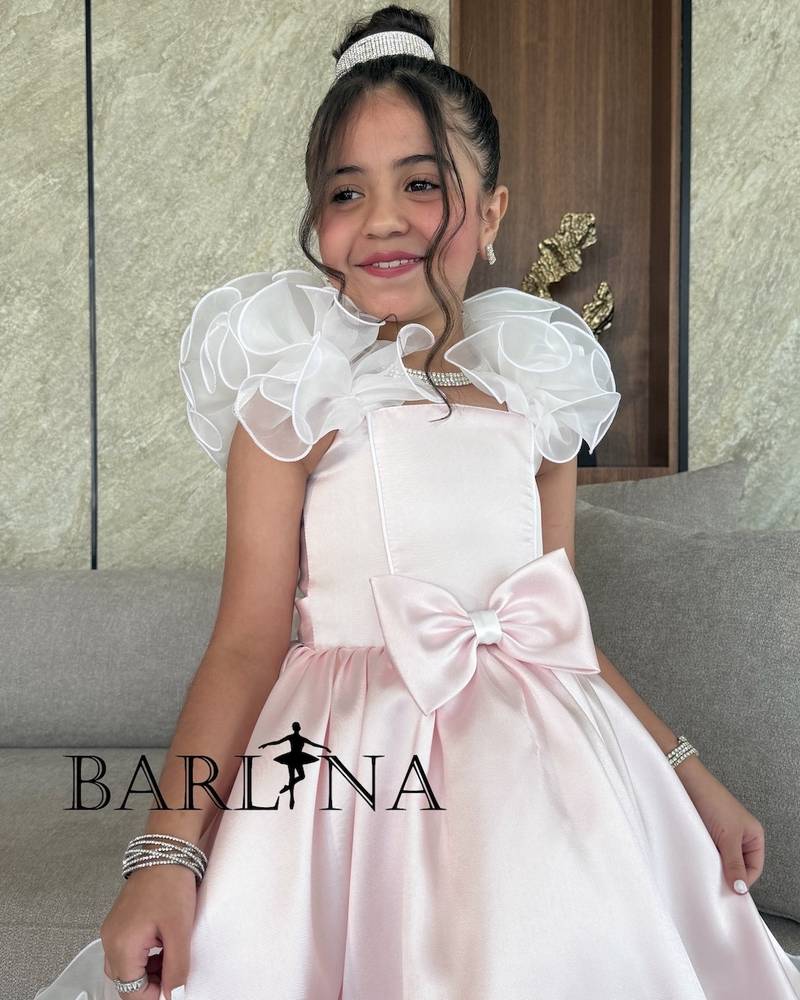 Girls' pink dress with elegant bow and ruffles