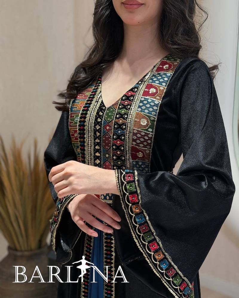 Black jalabiya embroidered with colorful patterns