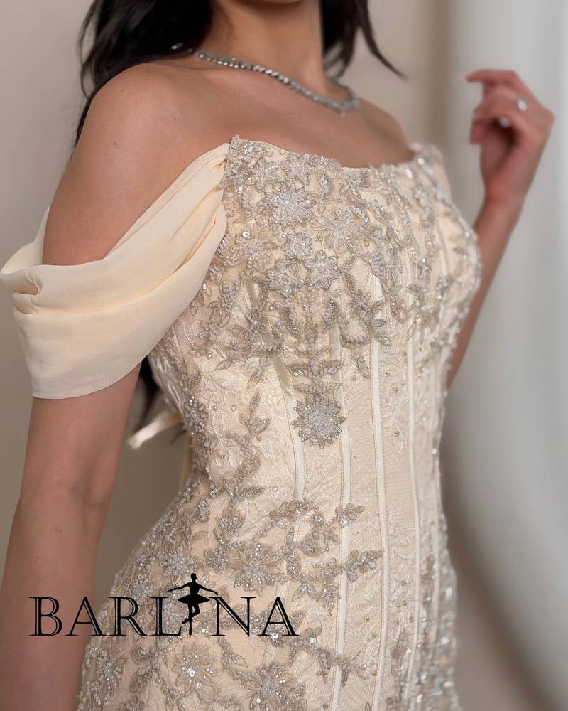 Creamy corset evening dress with draped silhouette