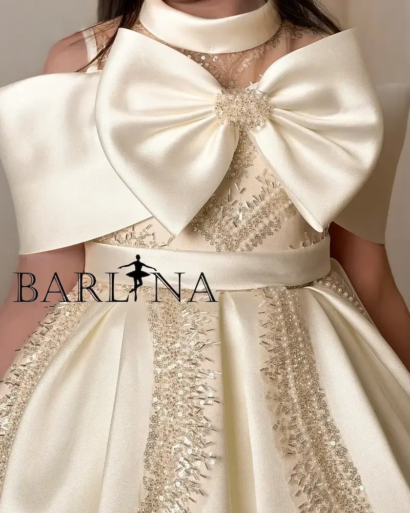 Beige girls' dress with a luxurious design and elegant embroidery