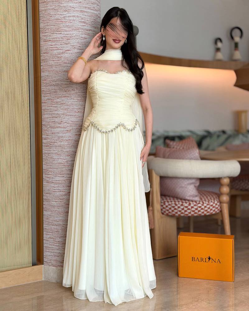 Off-white evening dress with crystal details