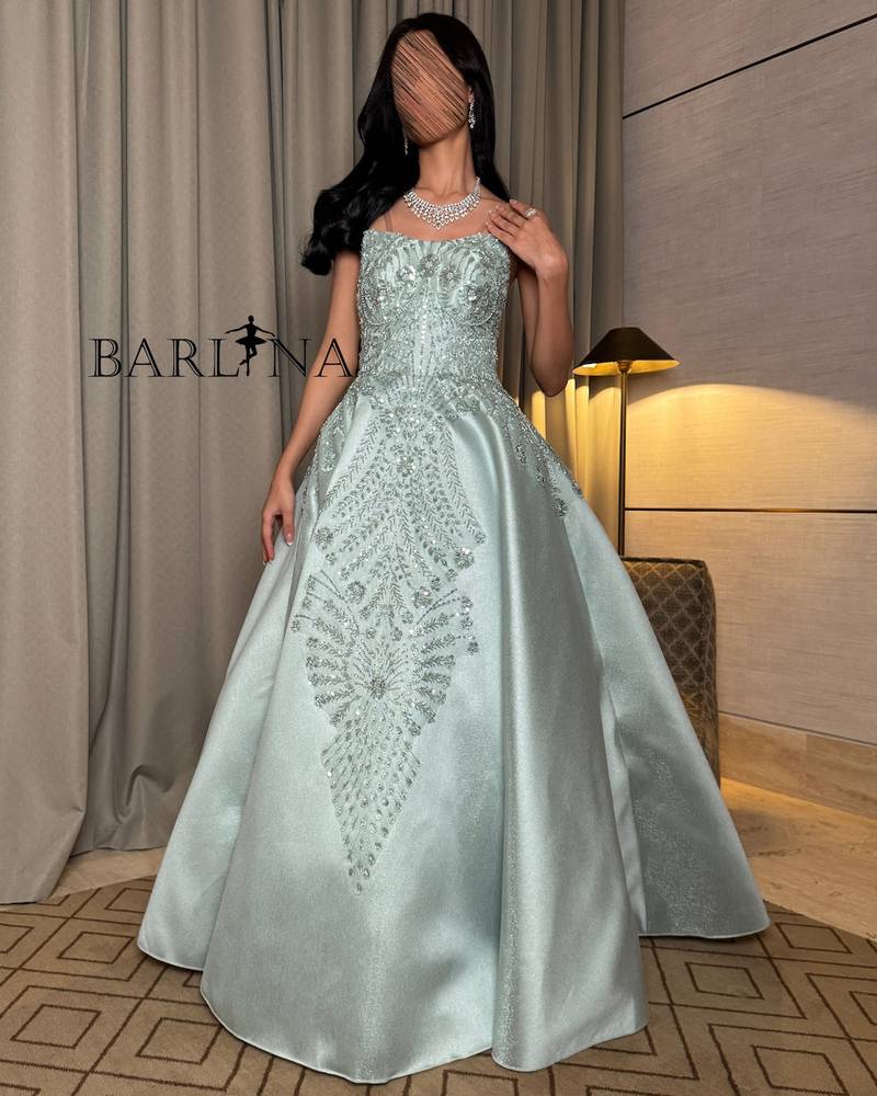Light green dress with elaborate floral motifs