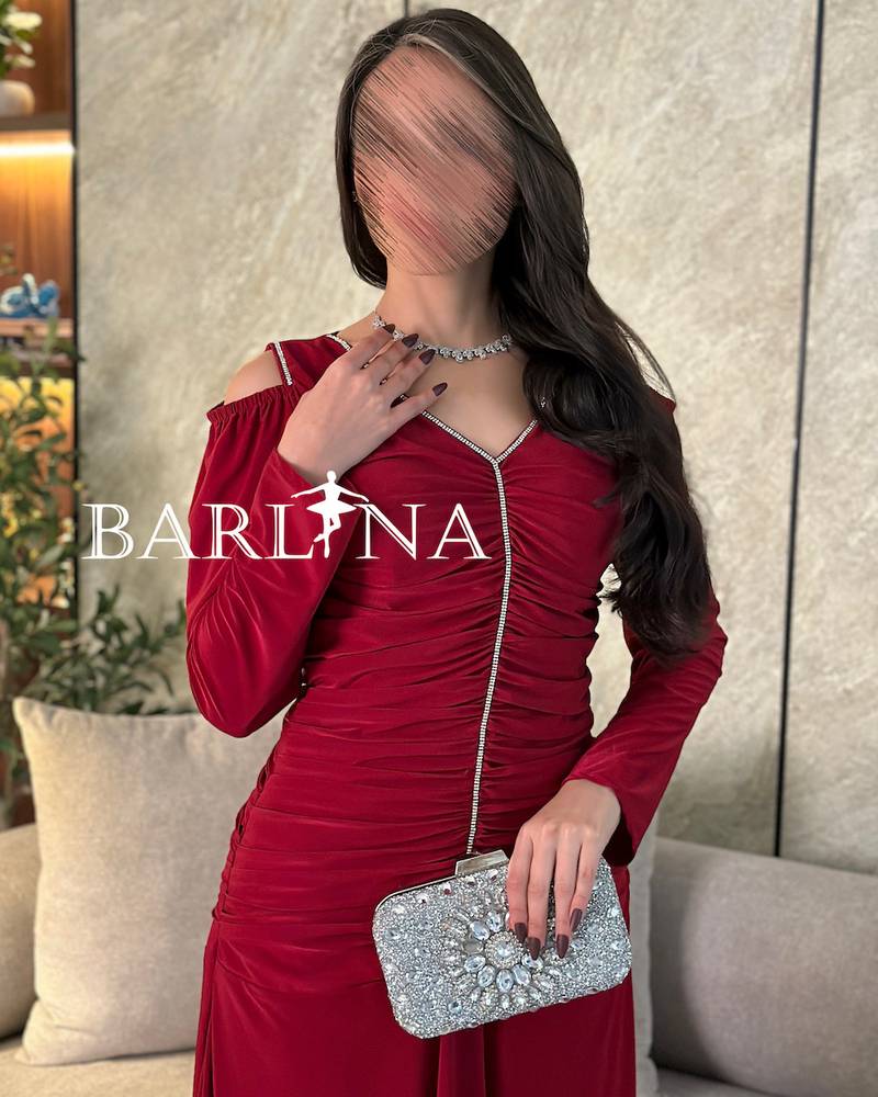 Burgundy dress with crystals along the design