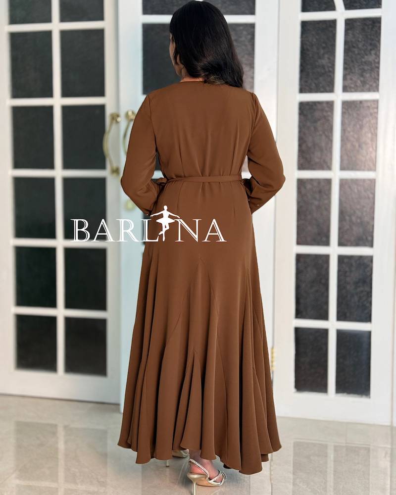 A soft brown dress with sleeves adorned with pearl embroidery.