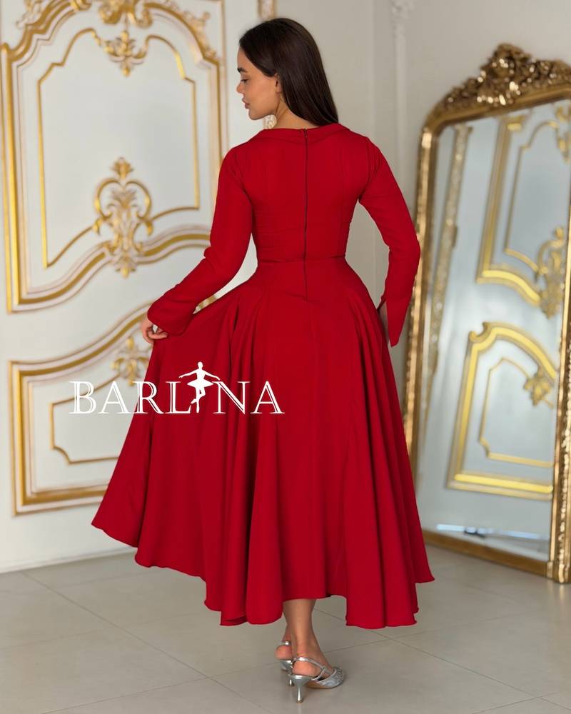 Red dress with a straight cut and pearl side buttons