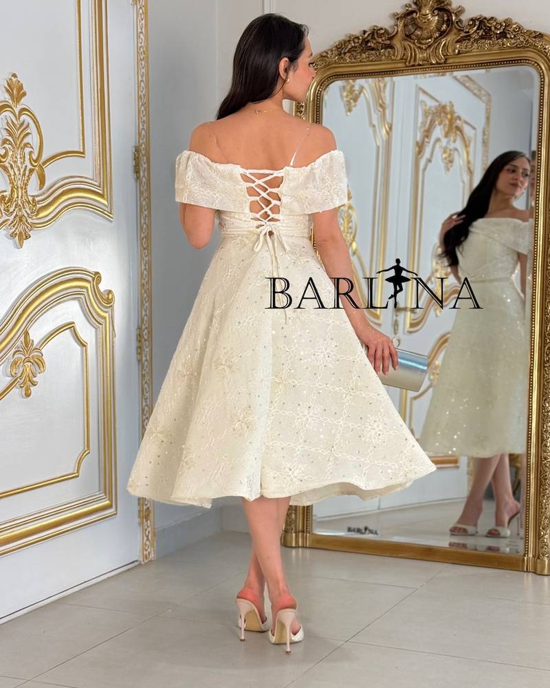 Off-white midi dress with a subtle sheen