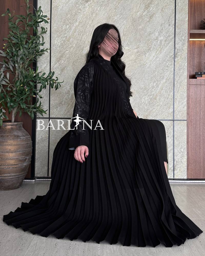 Luxurious black abaya with soft pleats throughout