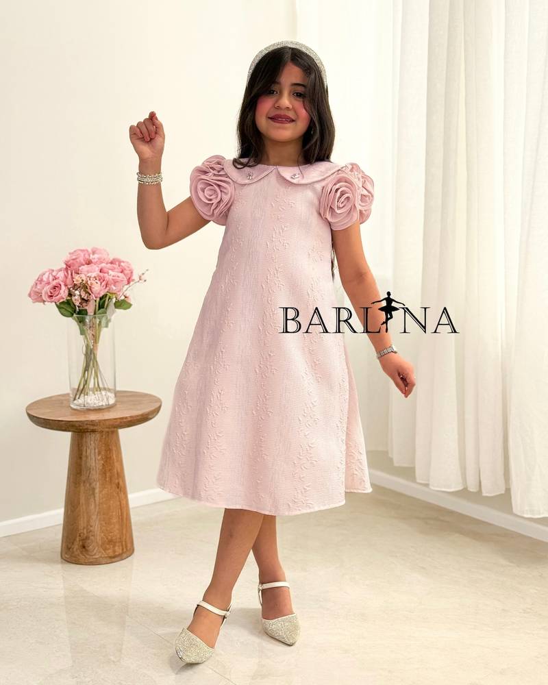 A girl's dress with a wide cut and prominent roses