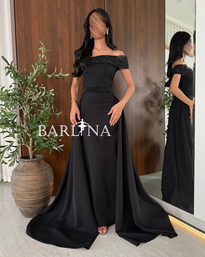 Black one-shoulder dress with pearl embroidery