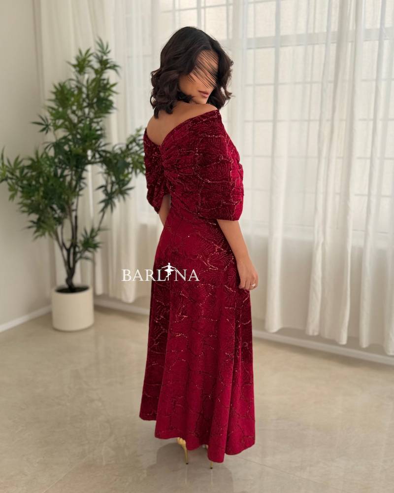 A red dress with an elegant design and luxurious embroidery.
