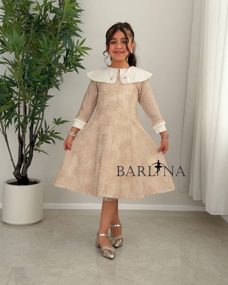 Dark beige girls' dress decorated with a floral pattern