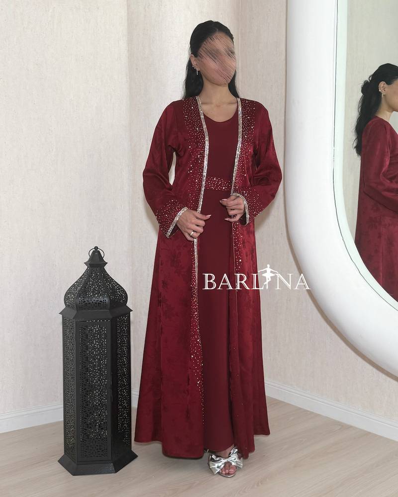A soft maroon jalabiya with external embroidery