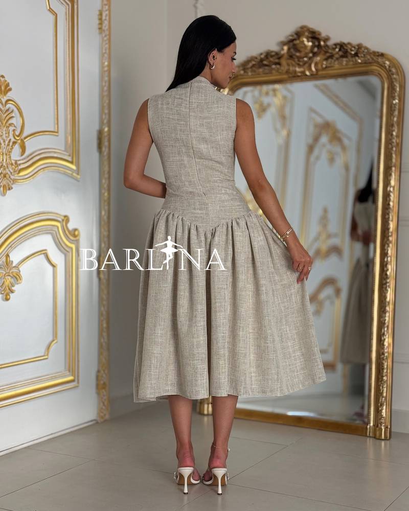Beige fitted dress adorned with crystals