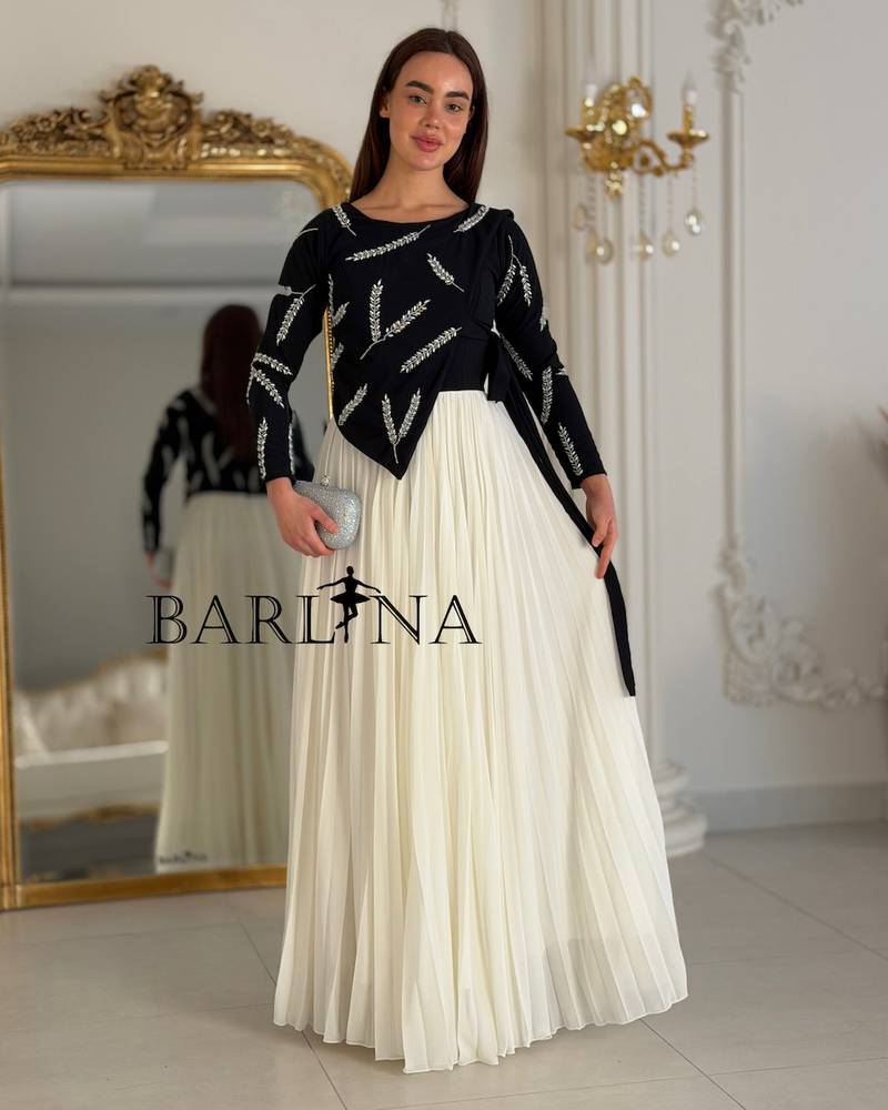 A black and white dress with elegant embroidery