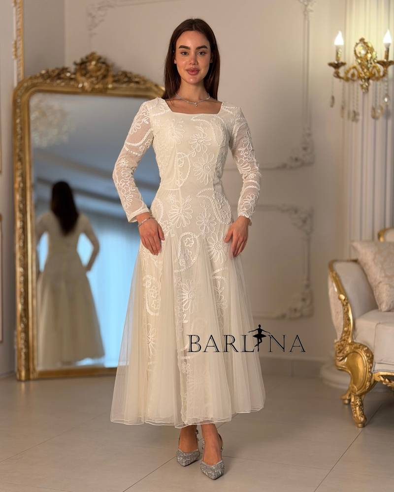 Soft white tulle dress with lace embroidery