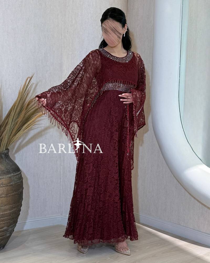 Burgundy lace dress with a wide sheer cape