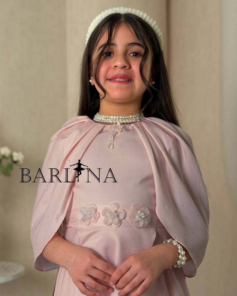 Girls' outfit with a long blouse and pleated pants