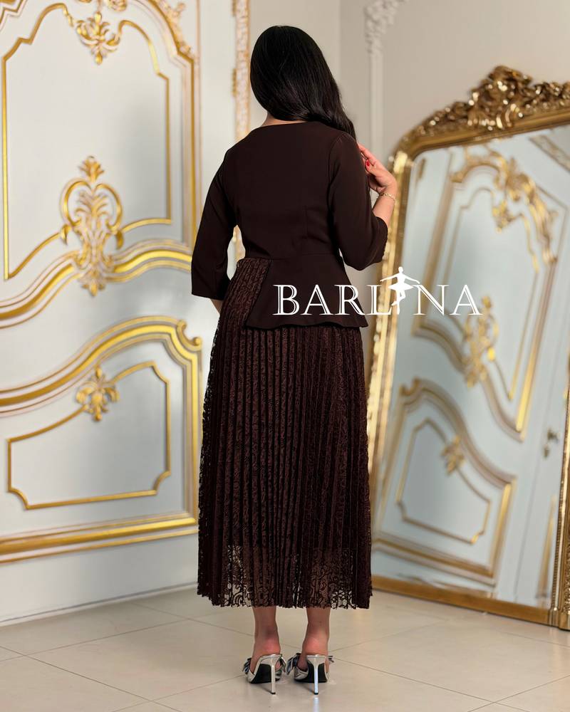 Brown lace dress with a rose detail at the waist