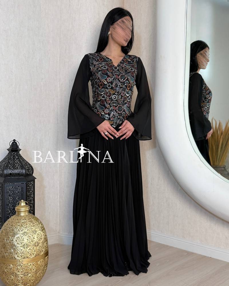 Black pleated jalabiya with an embroidered bodice