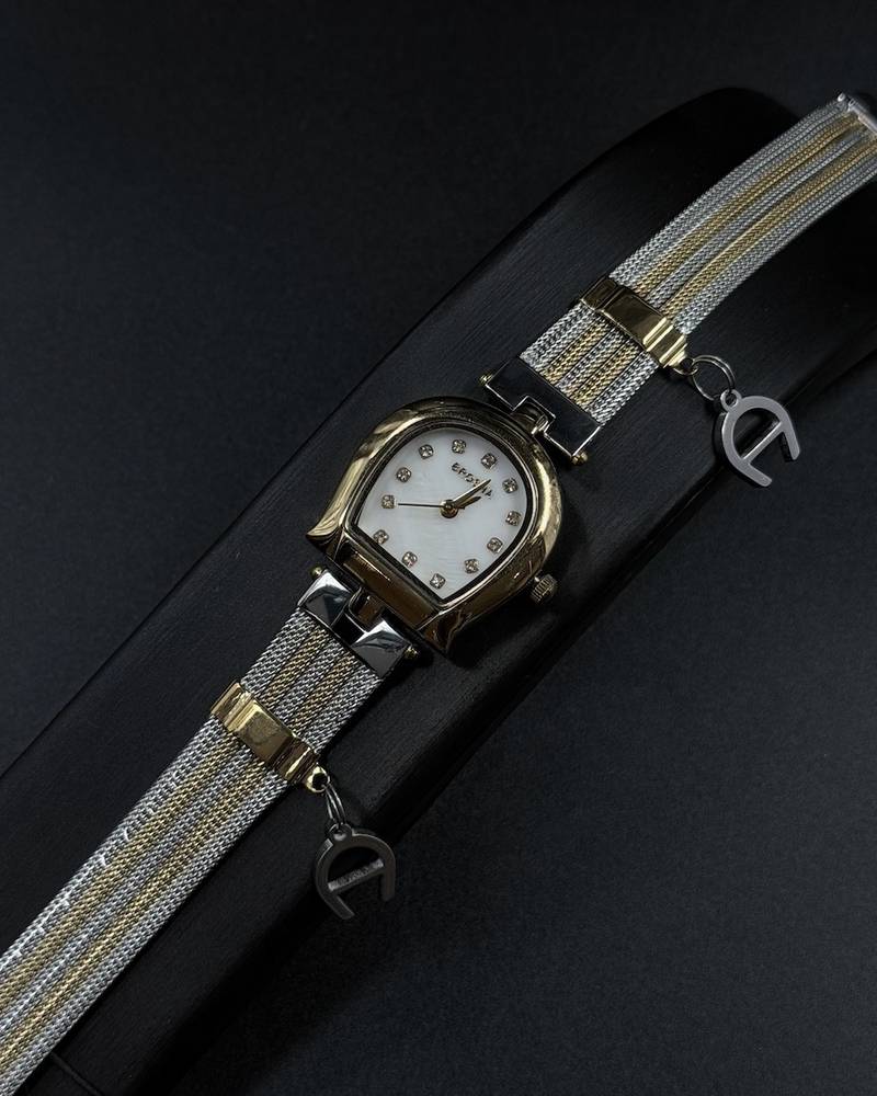 Elegant women's watch adorned with a charm