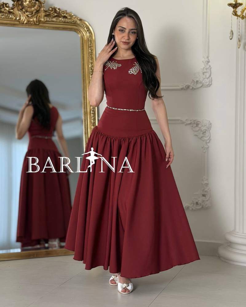 Long burgundy flared dress with a low waist
