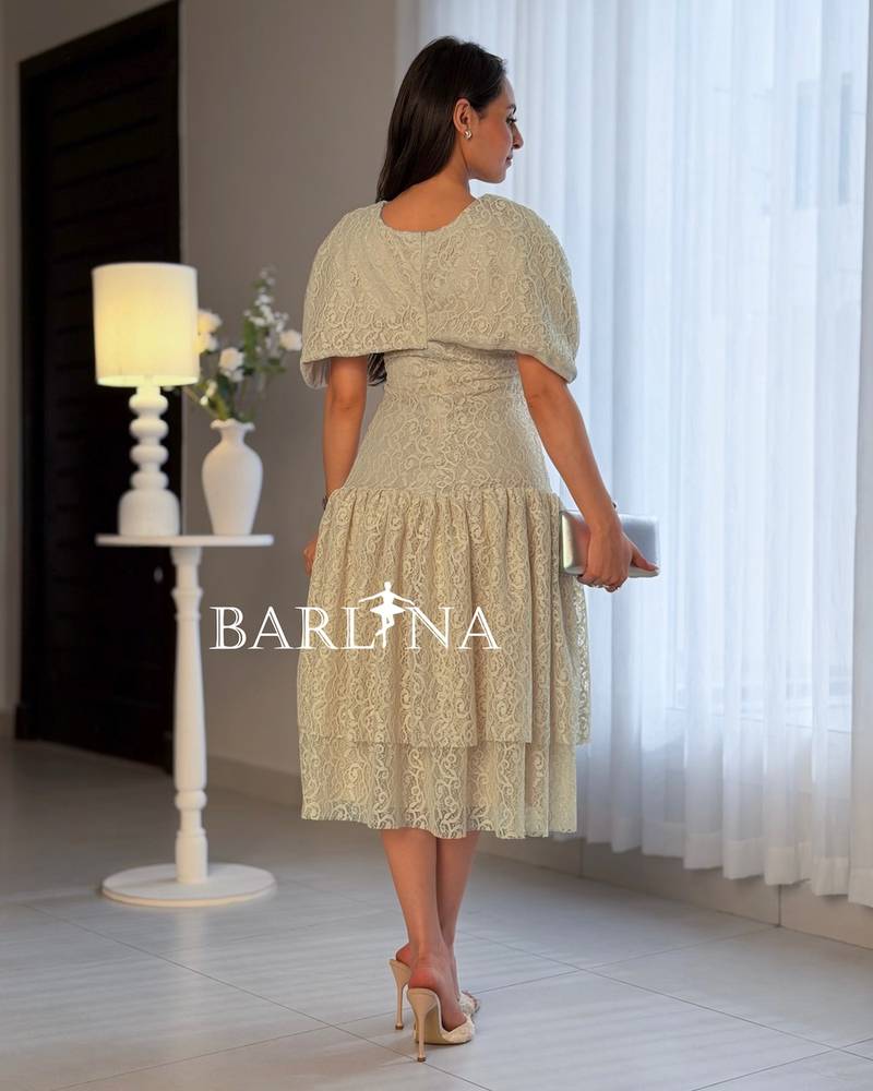 Beige lace dress adorned with pearls