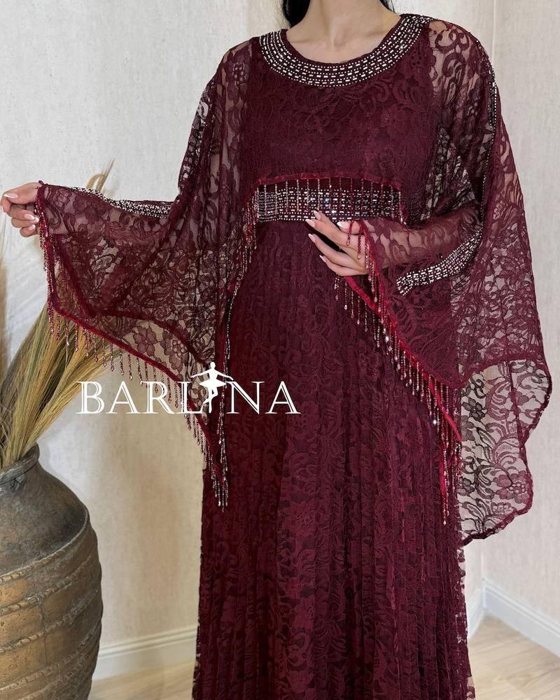Burgundy lace dress with a wide sheer cape