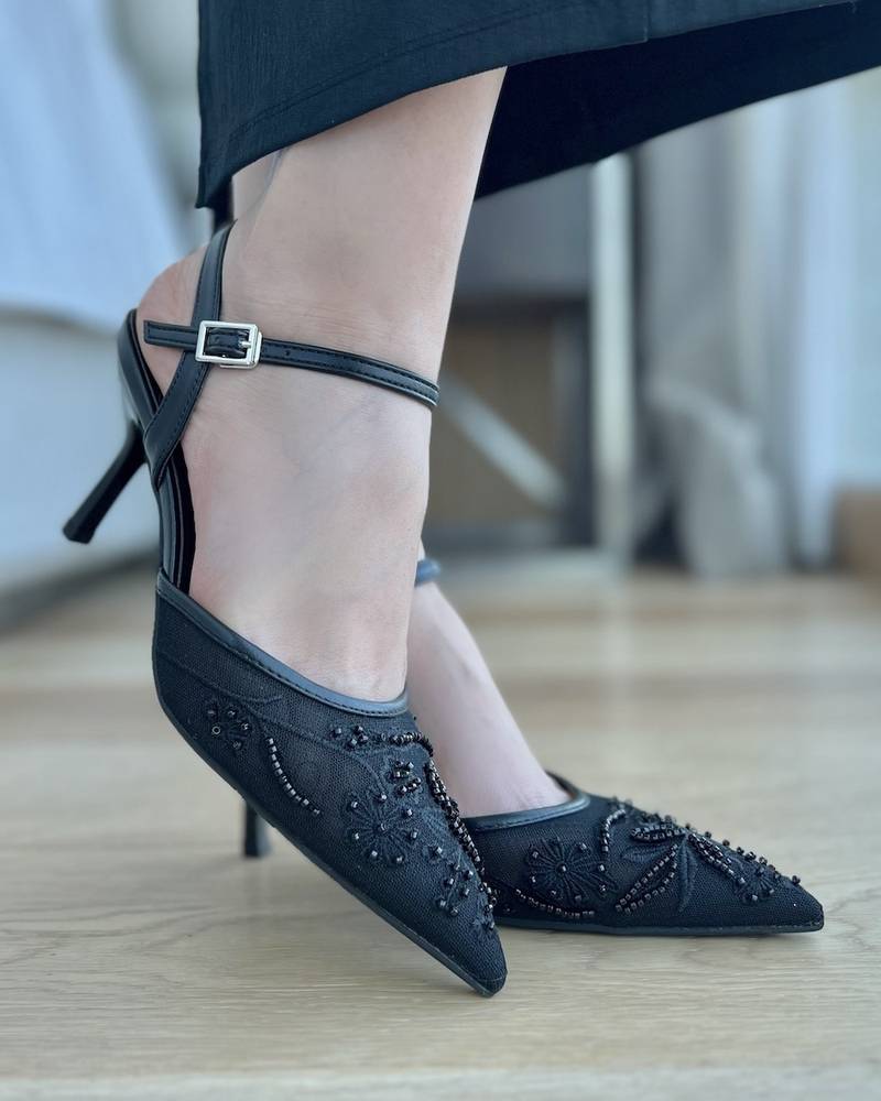 Elegant transparent women's heel with a thin strap