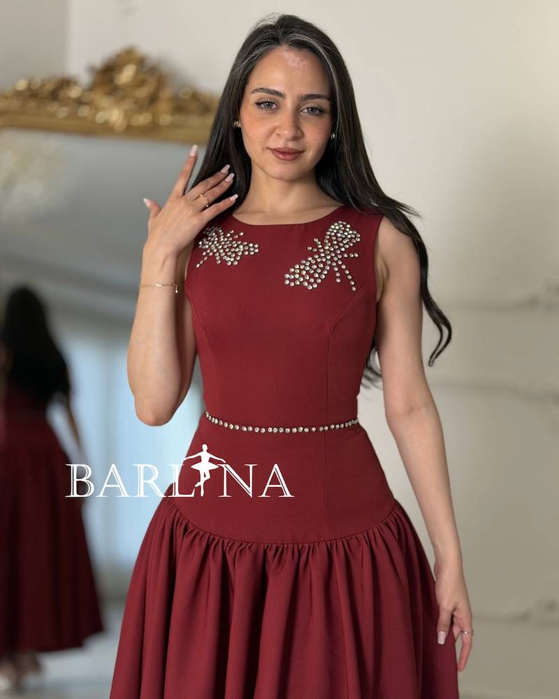 Long burgundy flared dress with a low waist