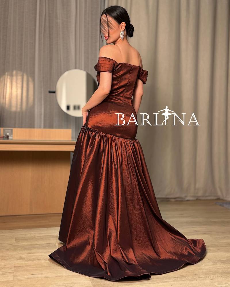 A shimmering off-the-shoulder evening dress