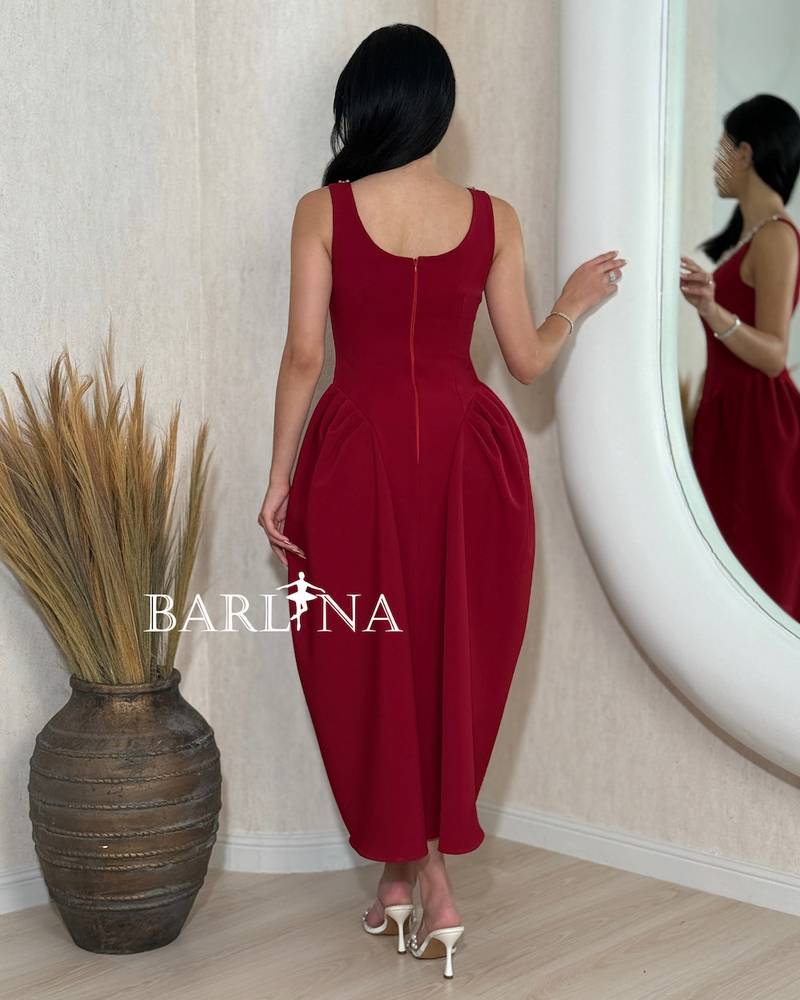 Red sleeveless midi dress with a studded collar