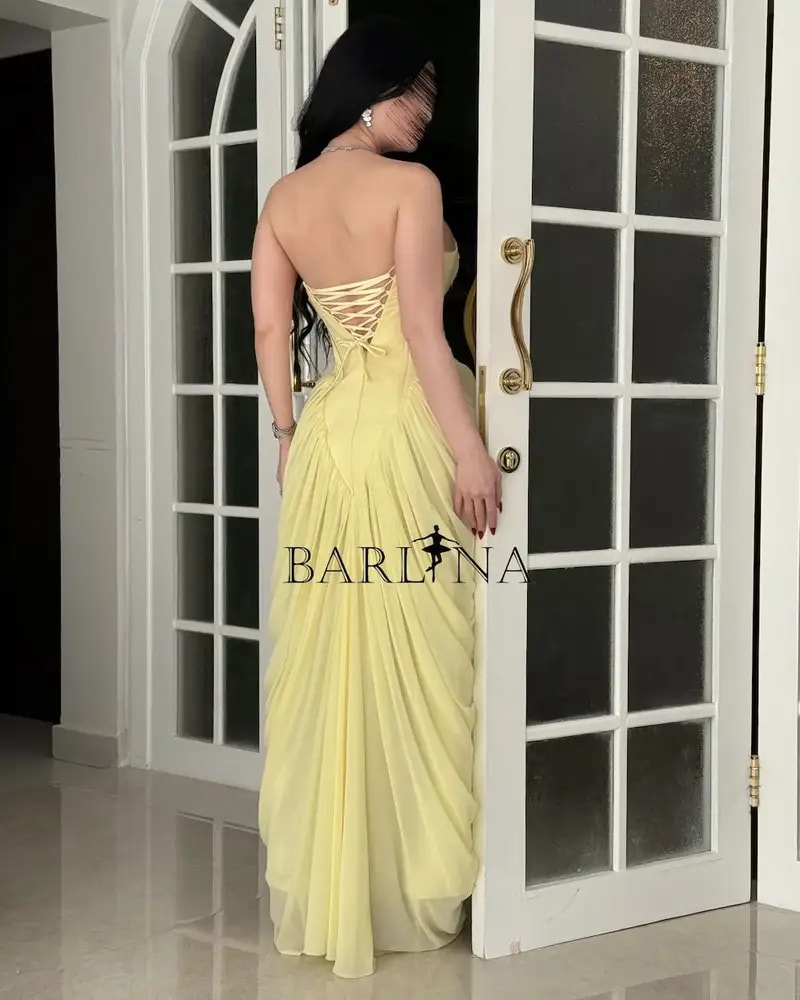 Yellow dress with delicate embroidery and ruffle details