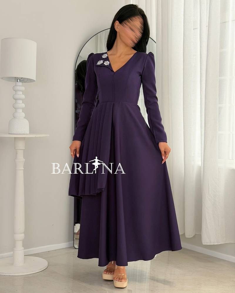 Purple dress with a V-neck and crystal embellishments