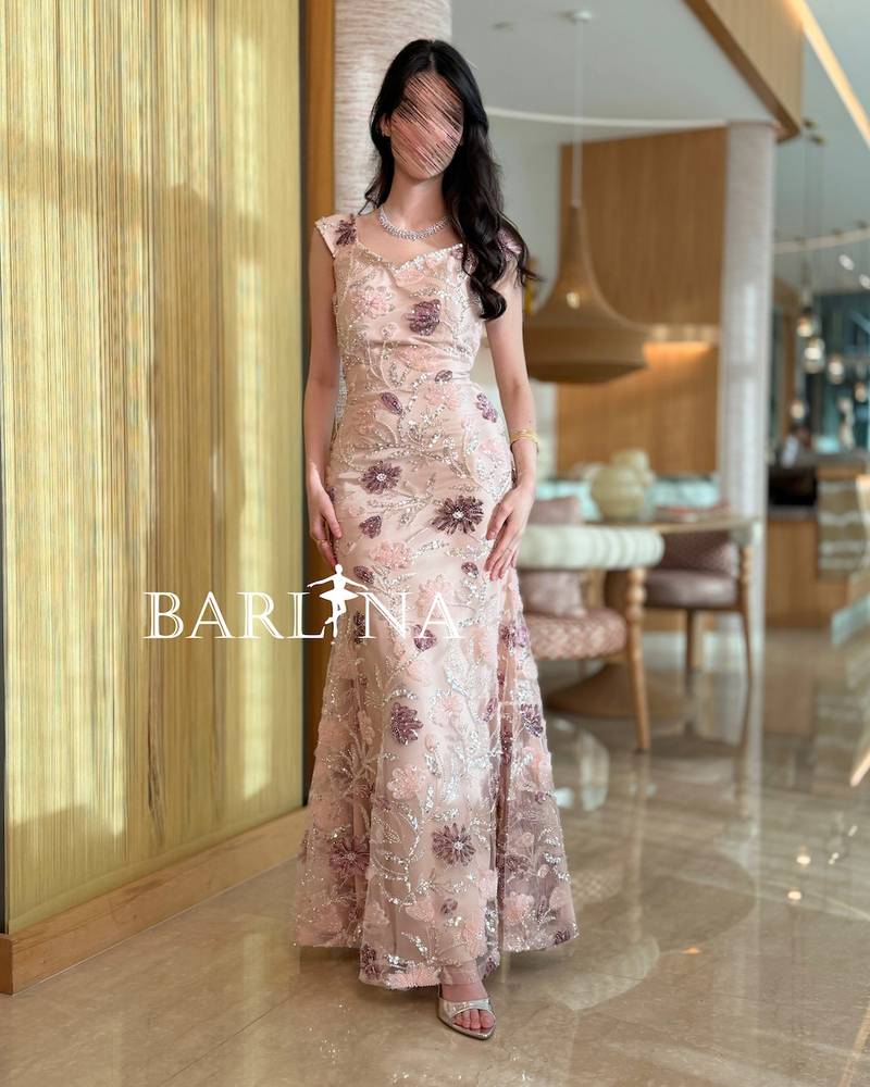 A pink dress with pink embroidery and elegant glitter