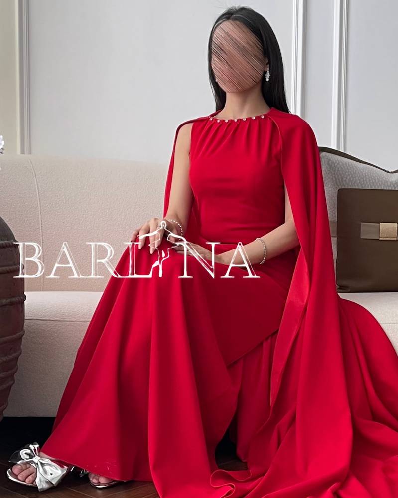 Long red evening dress with cape and crystals