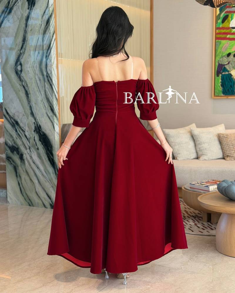 Burgundy dress with silver embroidery on the bodice