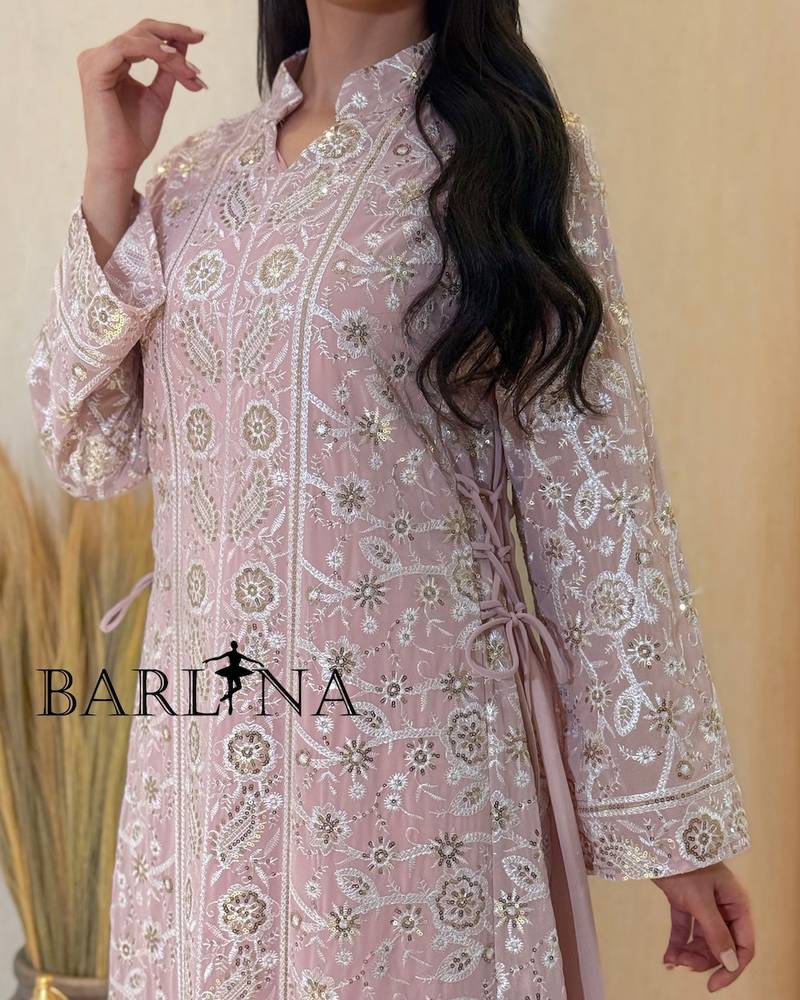 jalabeya with white embroidery and a side tie