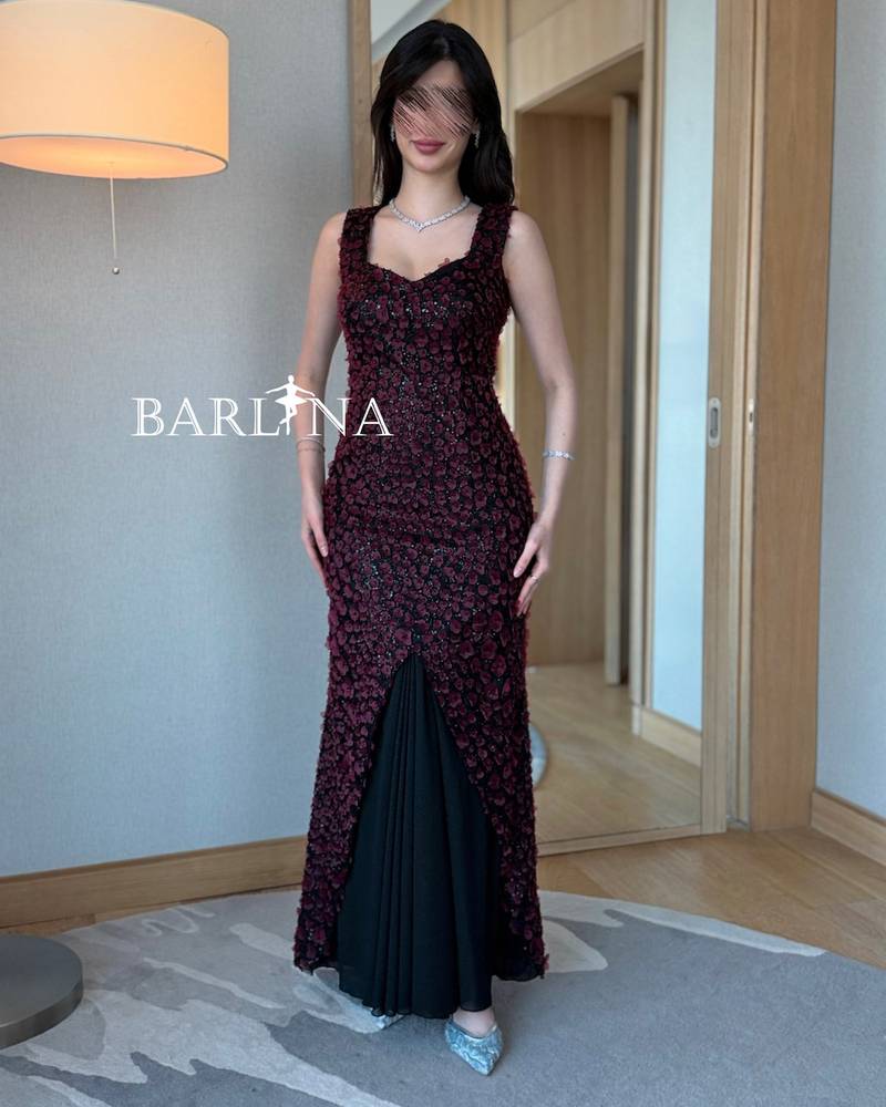 Elegant black dress with prominent red embroidery