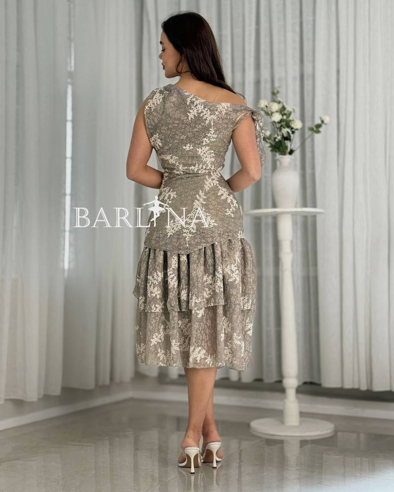 A dress with a soft cut and delicate lace details.